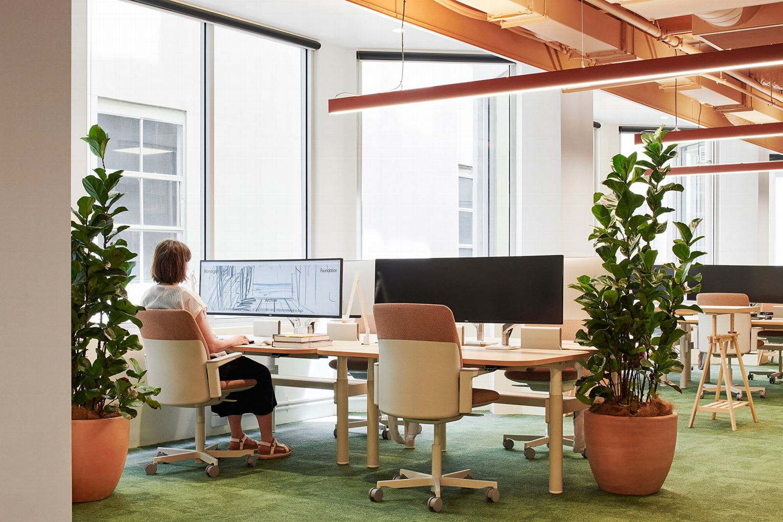 someone working in sunlit ergonomic workspace